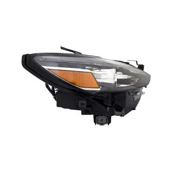 Detached front headlight assembly with a clear lens, amber turn signal, and black housing.